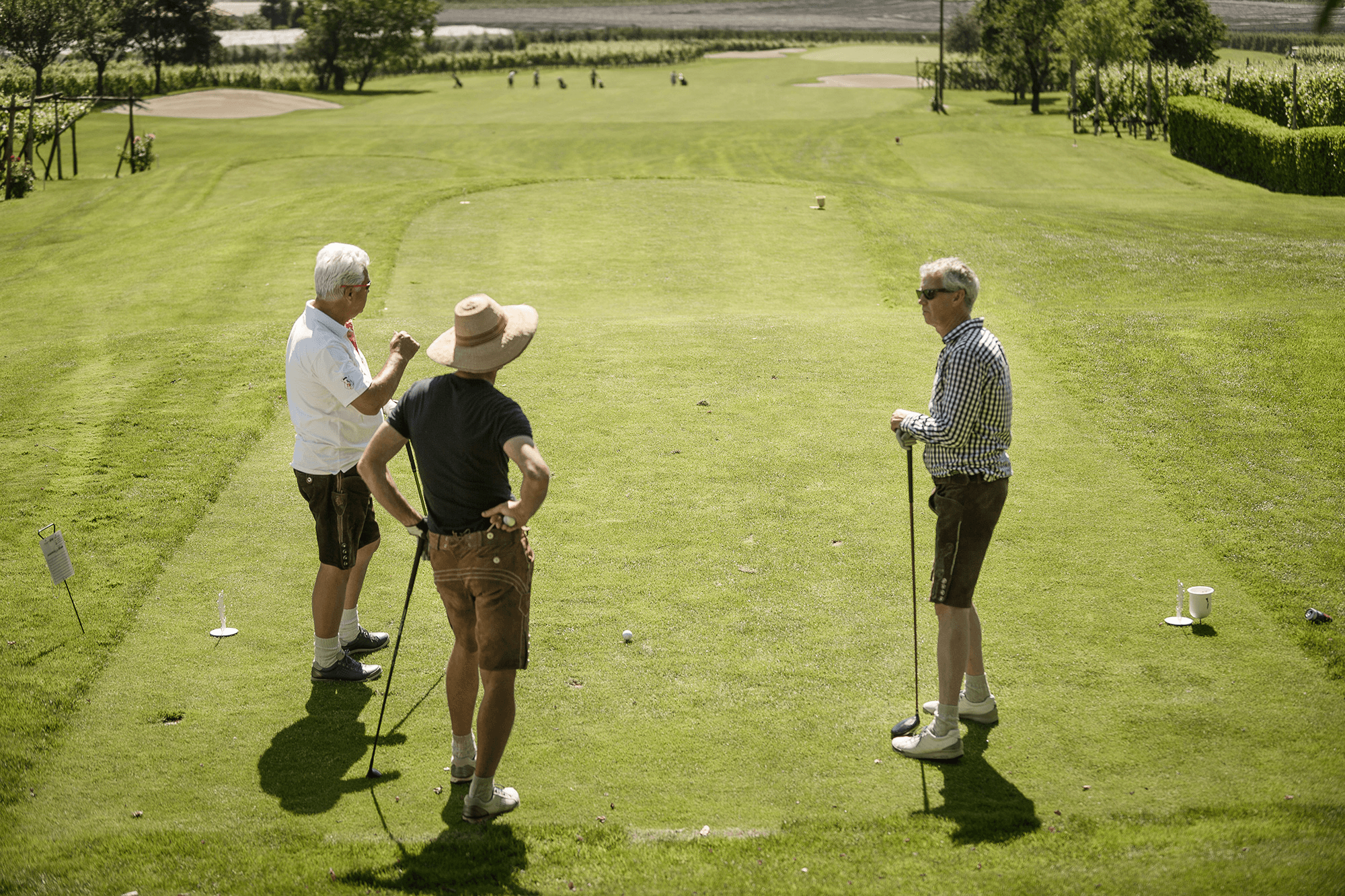 Golfers preparing on the tee